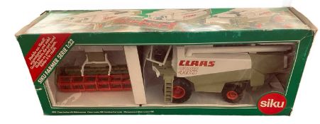 A boxed SIKU 1:32 scale model Claas Lexicon 480 Combine Harvester