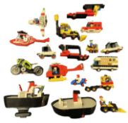 A collection of various 1980s Lego vehicles and boats