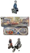 A collection of various tin plate toys