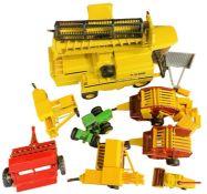 A collection of various die-cast and plastic agricultural vehicles, mostly Britains