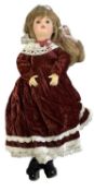 An SFBJ bisque head doll, marked SFBJ - PARIS - 9 to rear of head. Red painted lips, wearing