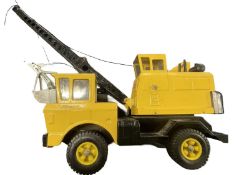 A large pressed steel Tonka grabber truck