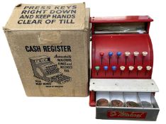 A vintage St Michael tinplate cash register, with original box and play money (a/f)