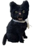 A mohair clockwork cat with ribbon collar, with opening mouth and twitching tail. (lacking key)