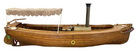 A scratchbuilt wooden steam boat model with canopy, 'Periwinkle', battery powered. Length