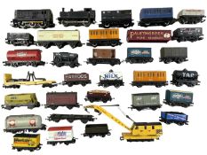 A mixed lot of various 00 gauge rolling stock, to include tankers, wagons, hoppers etc