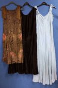 A quantity of c.1920/30's lady's clothing, to include a black velvet cloak by Dickins & Jones, a