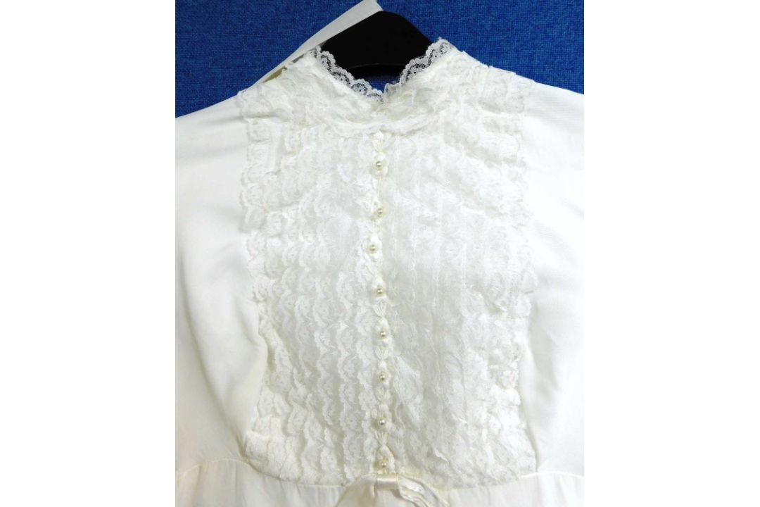 A circa 1960's/70's wedding dress with lace detail to front, frilled cuffs and hem with train - Image 2 of 7