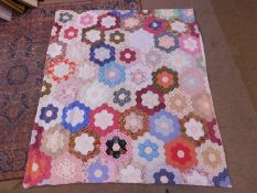 A mid 20th century patchwork quilt cover, with later plain cotton backing and press stud