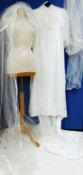 A circa 1960's/70's wedding dress with lace detail to front, frilled cuffs and hem with train