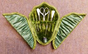 A cased set of matched needlework tools, the green velvet case to include a silver thimble