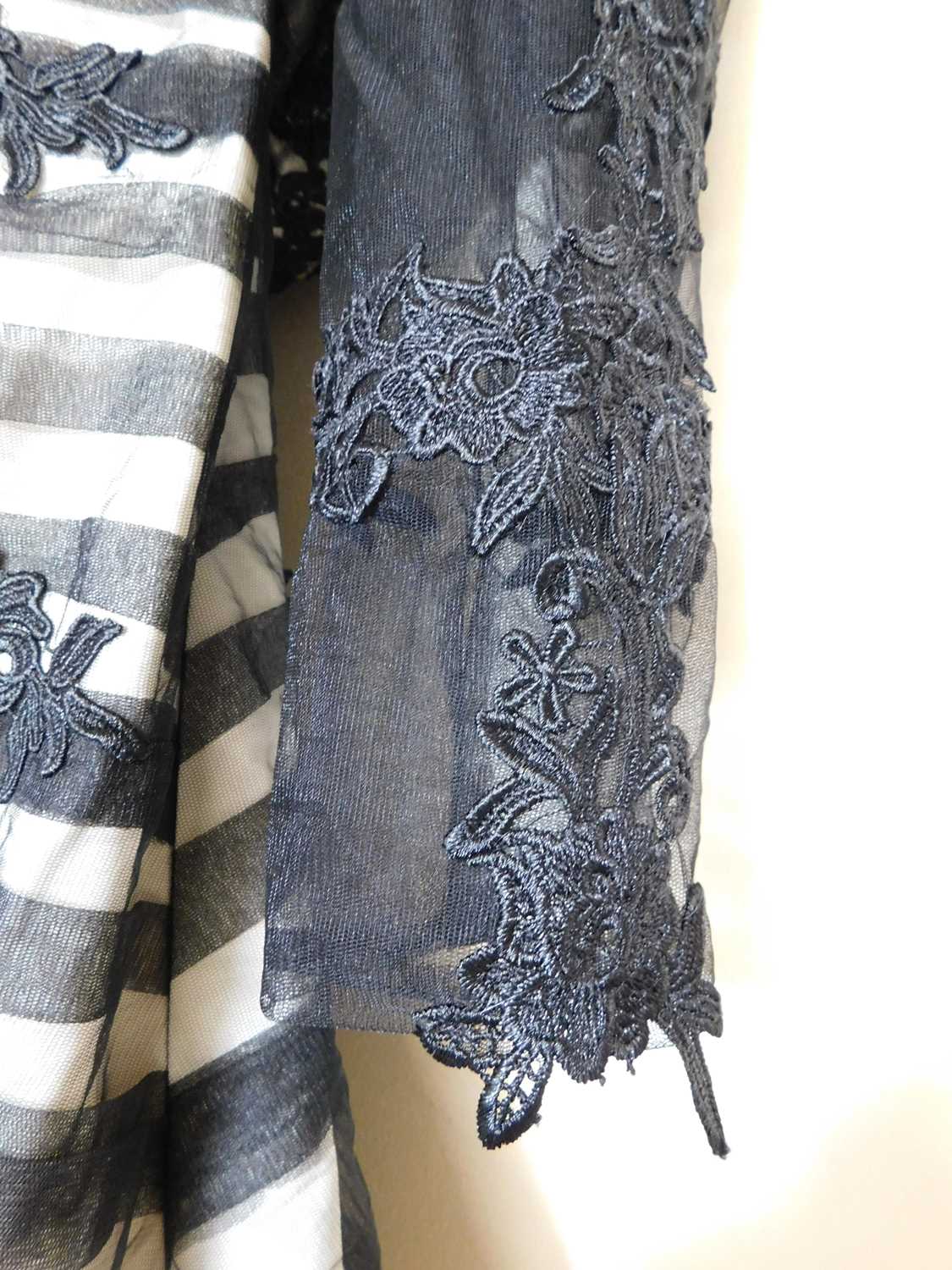A black and cream gown by Dylan Queen, the cream dress with black net and lace overlay, moulded - Image 4 of 5