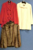 Three lady's coats, to include a cream wool blend coat by Marks & Spencers size 14, a red double