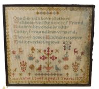 A late Victorian sampler, with polychrome crosstitch, named 'Annie Lovell Aged 11 Years 1877', 42