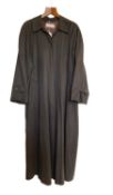 A lady's MaxMara trench coat, the soft brown coat with hidden placket button fastening and side