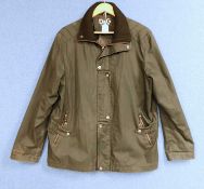 A lady's Dolce & Gabbana rain jacket with zip front overlapping popper details, zip pockets and