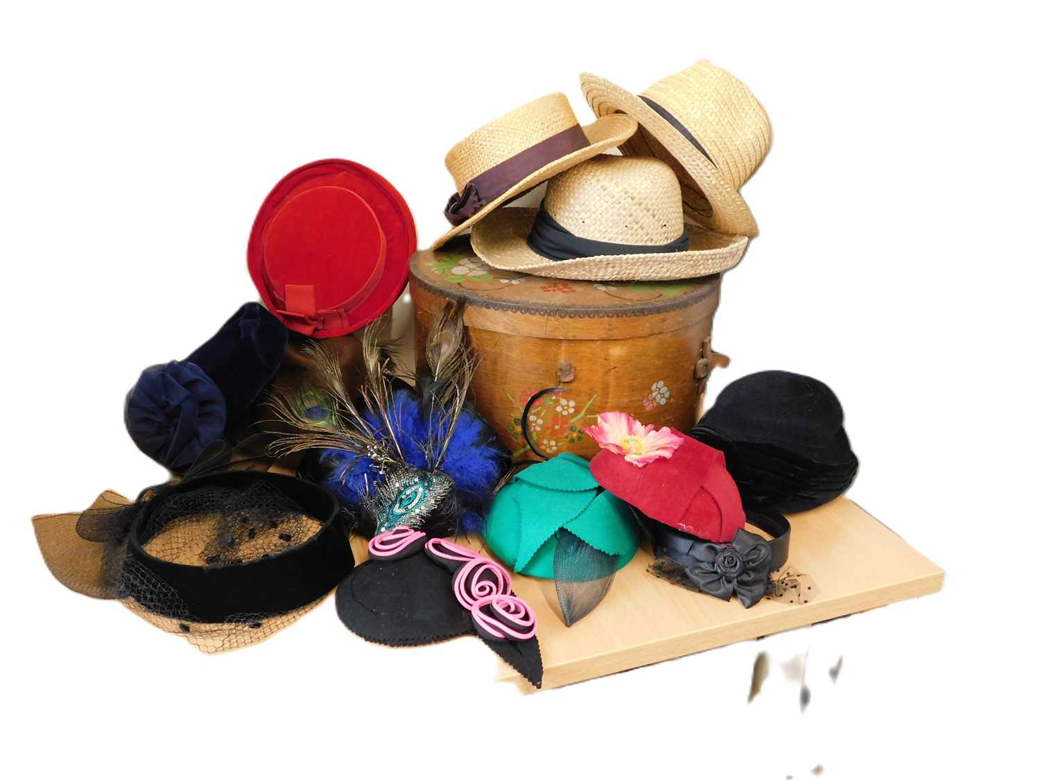 A wooden hat box and a quantity of assorted hats to include straw, 1940's style, fascinators, etc.