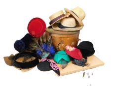 A wooden hat box and a quantity of assorted hats to include straw, 1940's style, fascinators, etc.