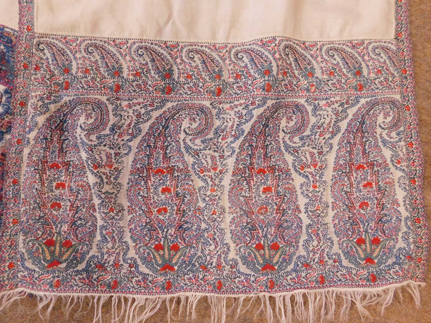 A 19th century shawl, with cream ground and red and blue paisley to ends and edges, approx. 226 x - Image 2 of 7