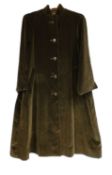 A lady's black velvet Aquascutum coat, single breasted with side slip pockets
