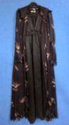 A black dress and chiffon coat cover with ruffle details, by Sally Poppy, size S