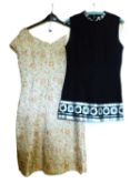 Two c.1960's dresses, to include a black and silver sleeveless shift minidress by Hershelle and a