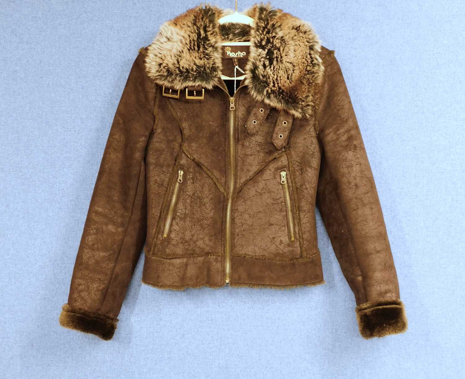 A brown faux suede and faux fur jacket by Kosha size S/10 with zip front, zip pockets and buckle