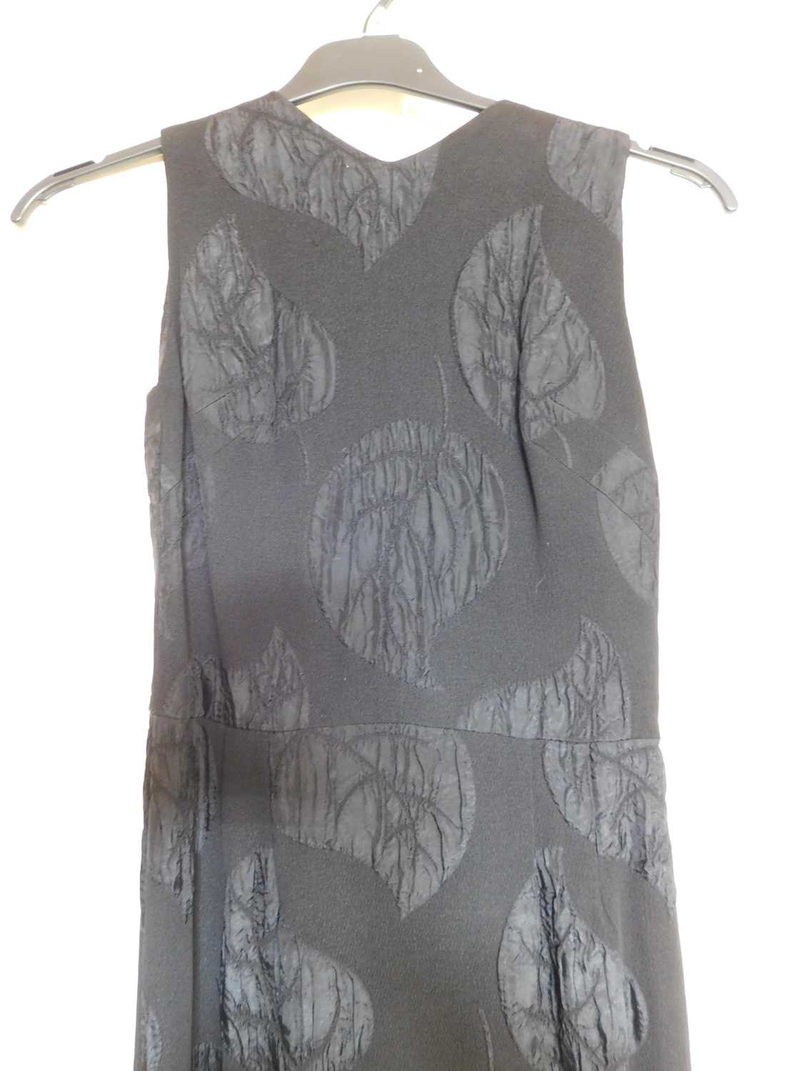 A c.1960's black shift evening dress, with crepe leaf design all over, open back with button - Image 4 of 5