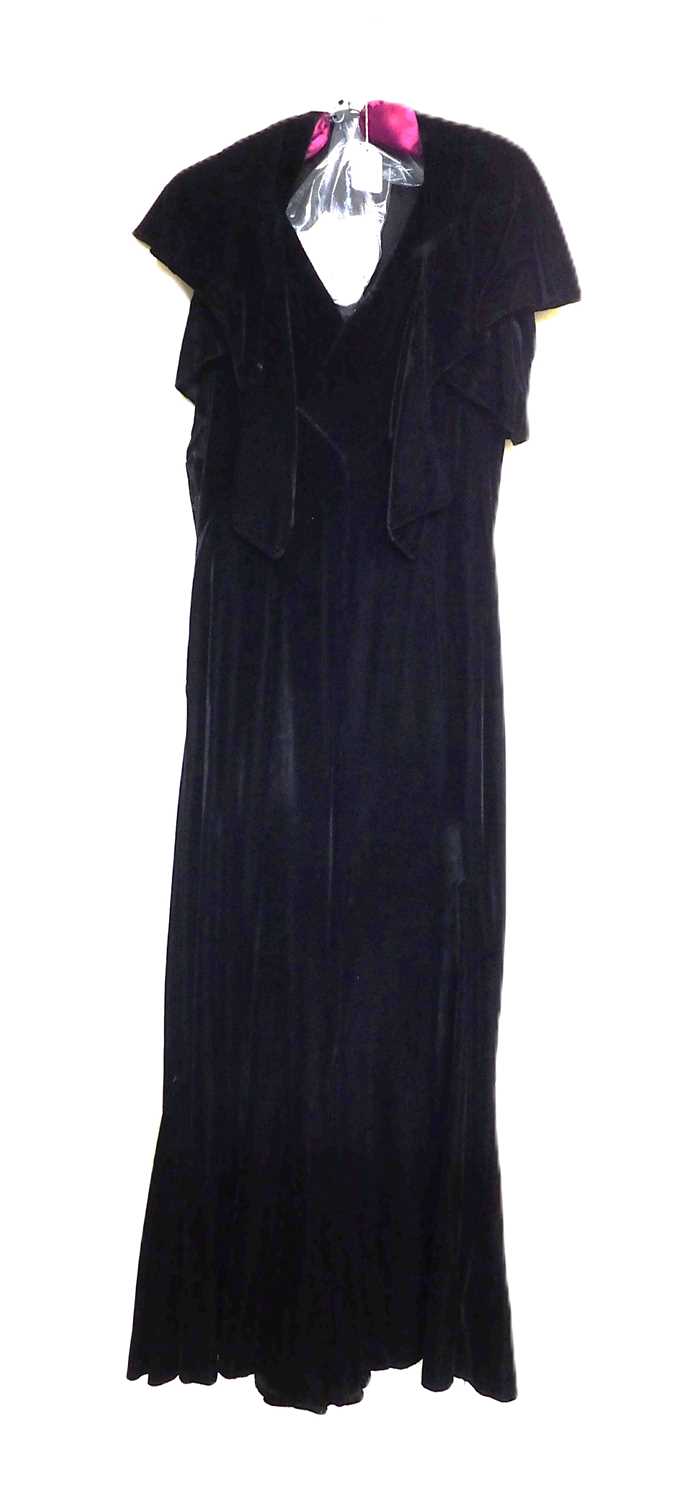 A black velvet evening gown, the sleeveless bias cut V-neck gown with matching shrug and long velvet