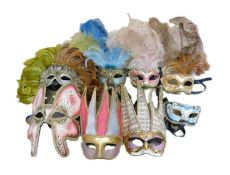 A group of Carta Alta Venetian masks, the papier mache masks in various colours with gilt