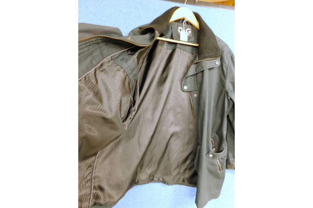 A lady's Dolce & Gabbana rain jacket with zip front overlapping popper details, zip pockets and - Image 3 of 7