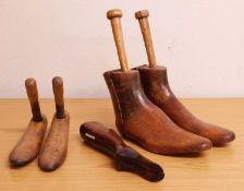 A novelty cased pair of button hooks, the steel hooks, folded inside a turned and shaped wooden,
