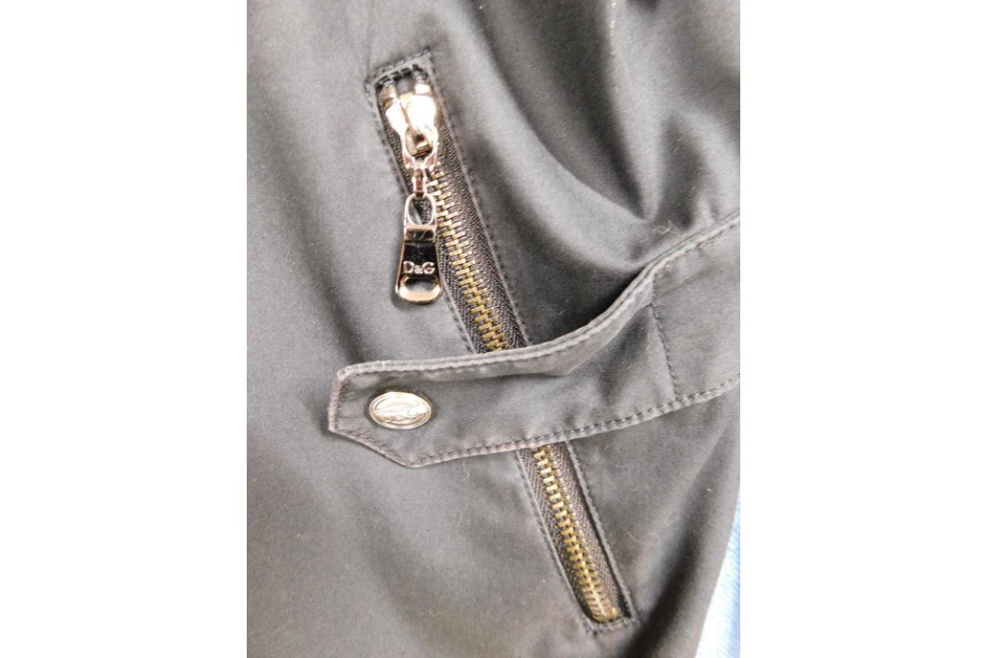 A lady's Dolce & Gabbana rain jacket with zip front overlapping popper details, zip pockets and - Image 4 of 7