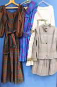 Four items of mid to late 20th Century lady's wear: to include a black and white two piece suit by