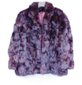 A ladies burgundy fur jacket, single breasted with side slip pockets, size 18