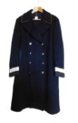 An Eastern Counties Omnibus driver/conductors overcoat, double breasted in navy blue wool, yellow