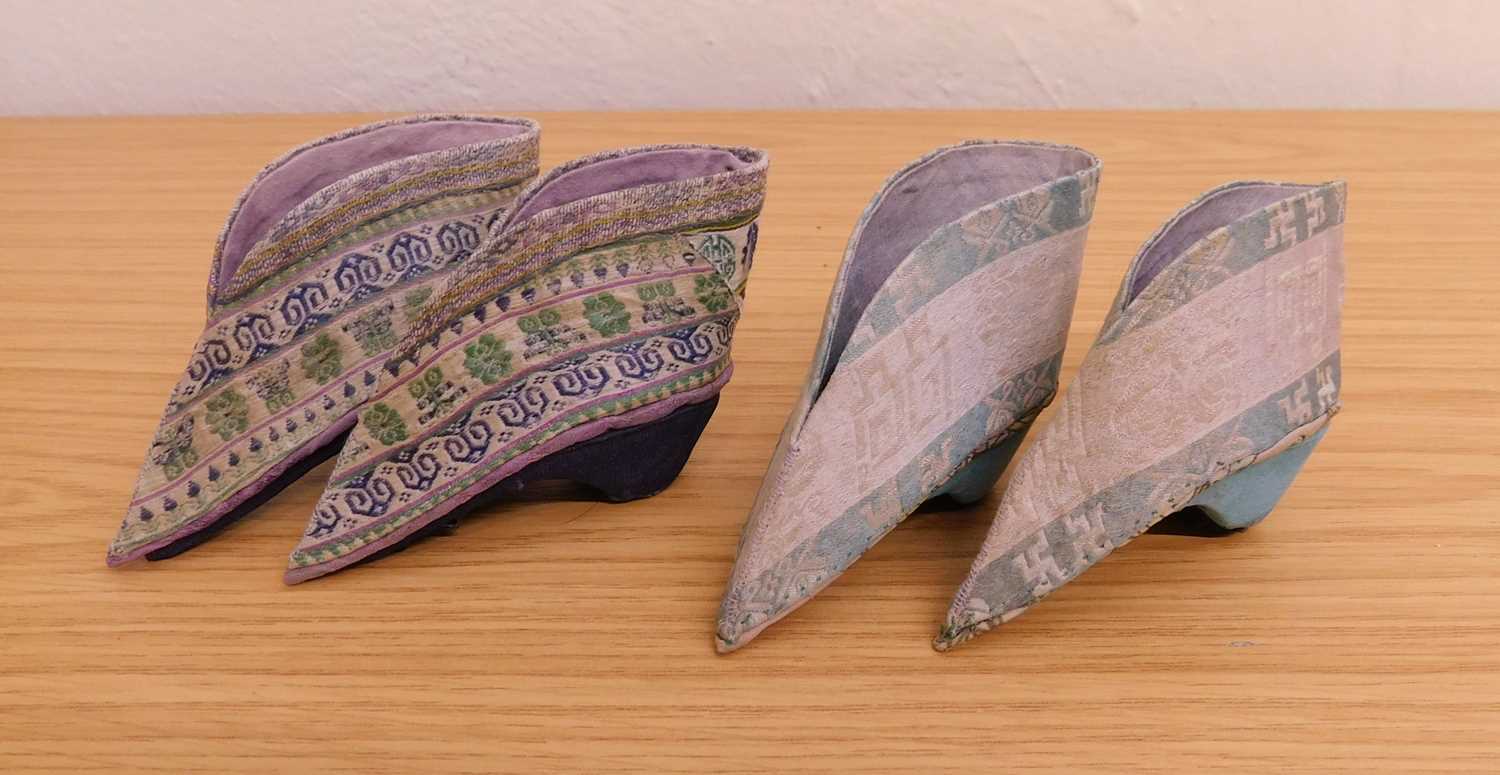 Two pairs of Chinese lotus shoes, the fabric shoes with fabric covered block heels, each approx. 9cm