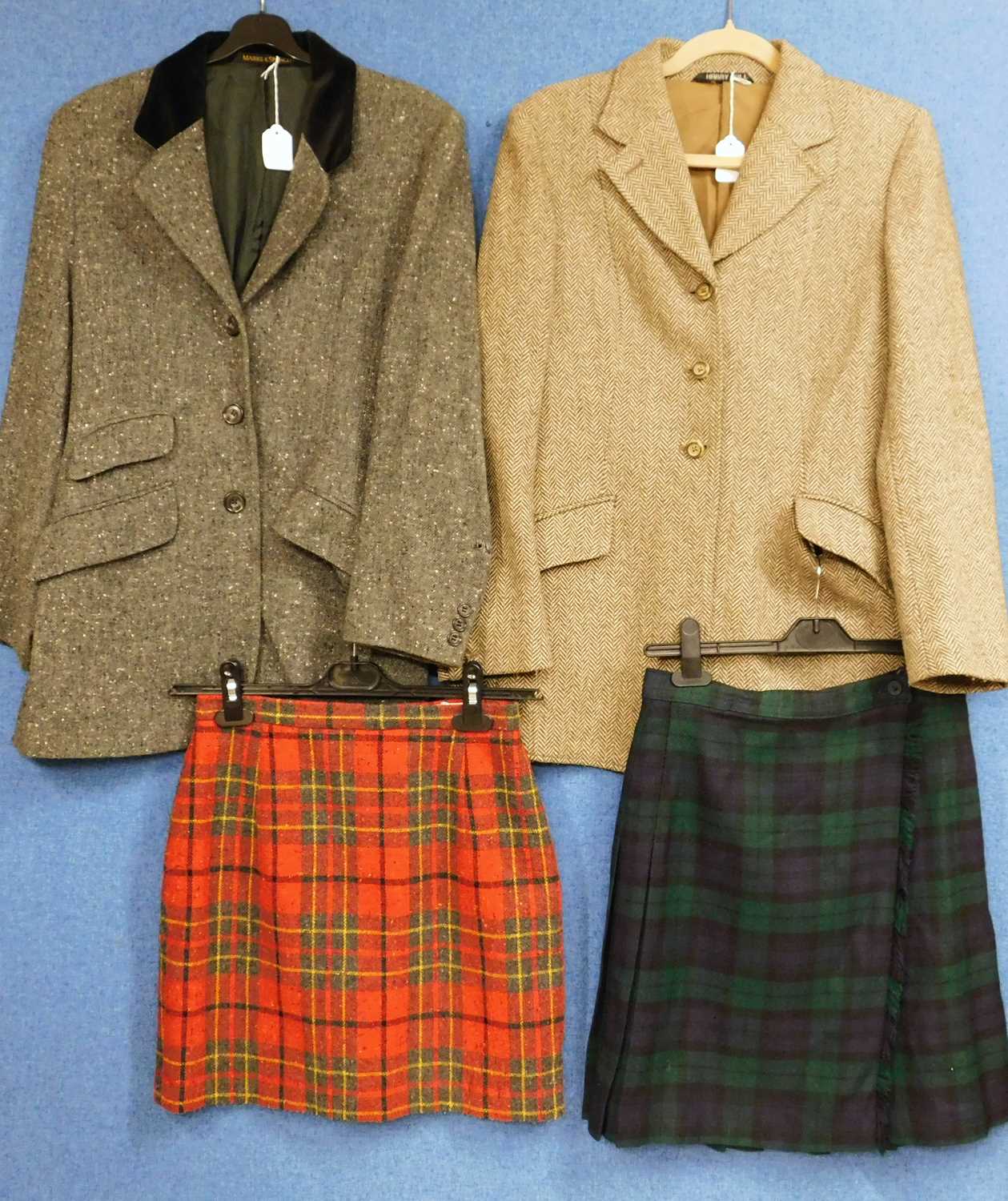 Two lady's jackets and two kilts to include a brown tweed Harry Hall three button single breasted