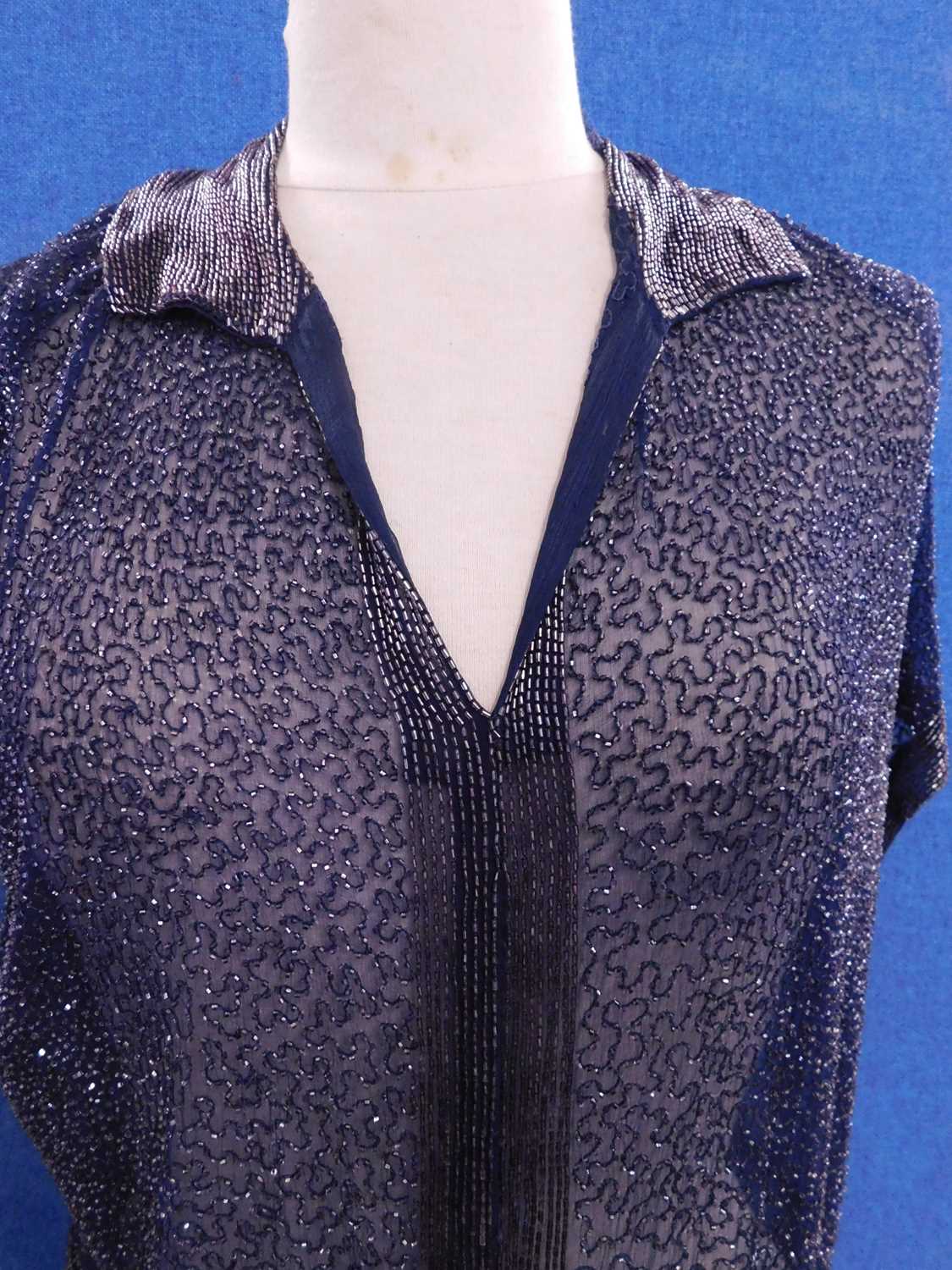 A navy blue chiffon heavily beaded dress with matching tie belt, with V-neck and collar with bugle - Image 2 of 6