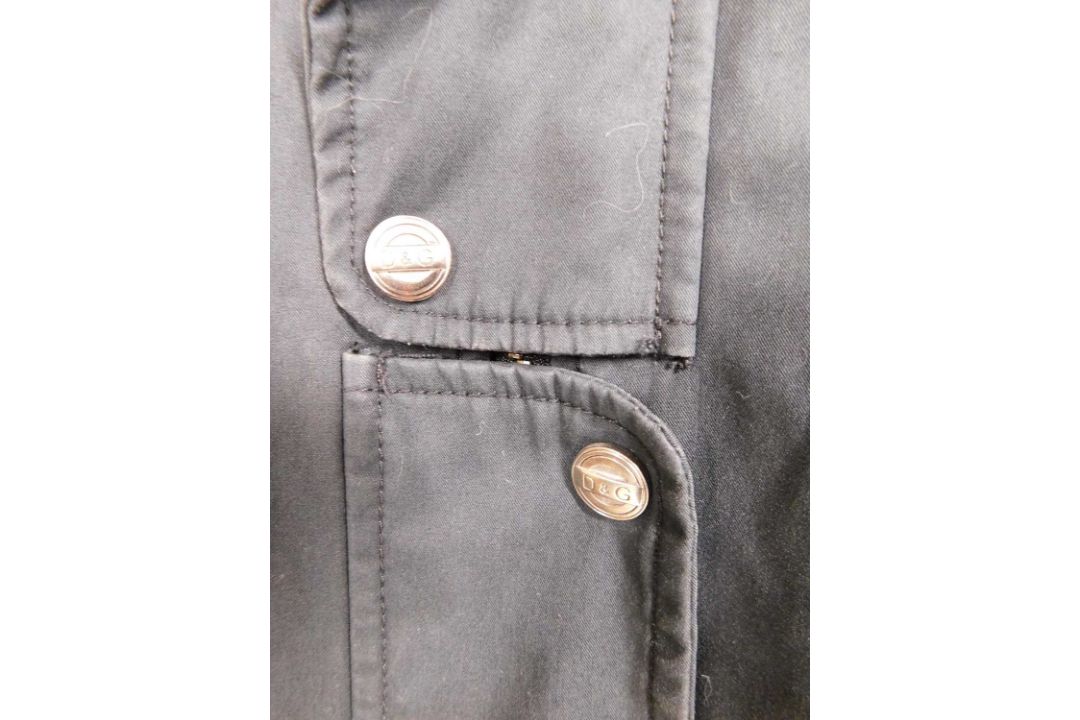 A lady's Dolce & Gabbana rain jacket with zip front overlapping popper details, zip pockets and - Image 7 of 7
