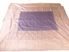 An Indian cotton and silk bedspread, with silvered and polychrome floral pattern, with deep cream