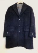 A gentlemans grey wool coat, single breast with front flap and slit pockets, with back placket,