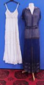 A navy blue chiffon heavily beaded dress with matching tie belt, with V-neck and collar with bugle