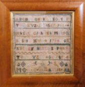 A 19th century needlework sampler, with alpha-numeric decoration and GR monogram and crown below,