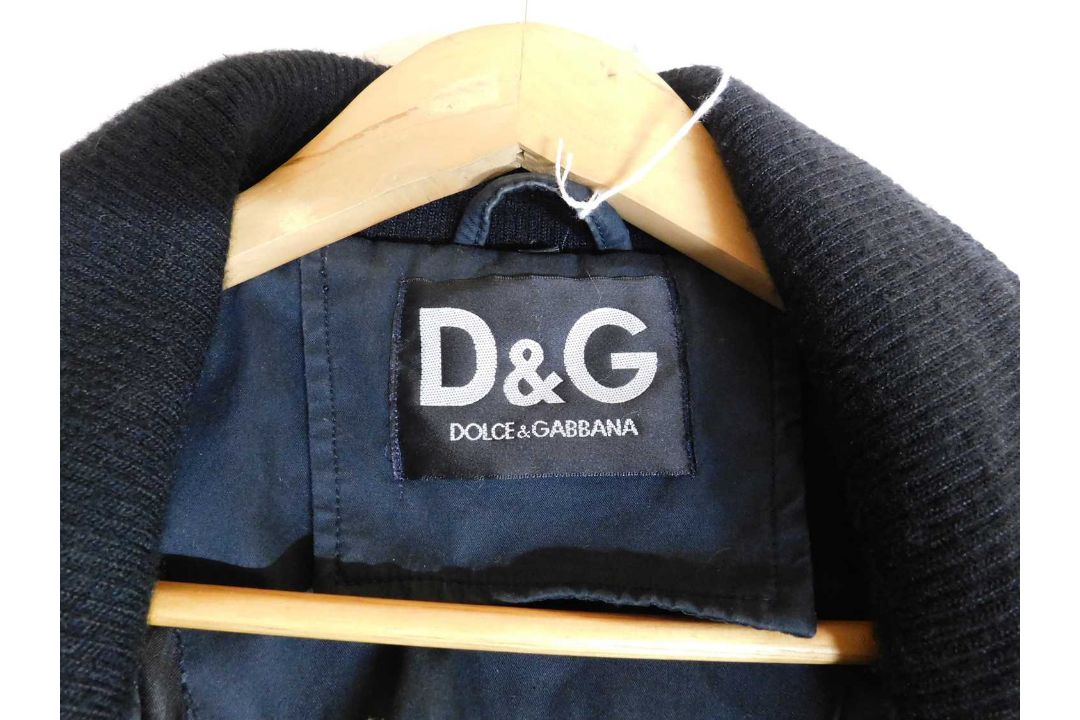 A lady's Dolce & Gabbana rain jacket with zip front overlapping popper details, zip pockets and - Image 6 of 7