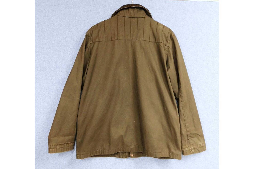 A lady's Dolce & Gabbana rain jacket with zip front overlapping popper details, zip pockets and - Image 2 of 7