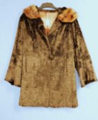 A lady's single breasted brown fur coat with single button and shawl style rounded fur collar