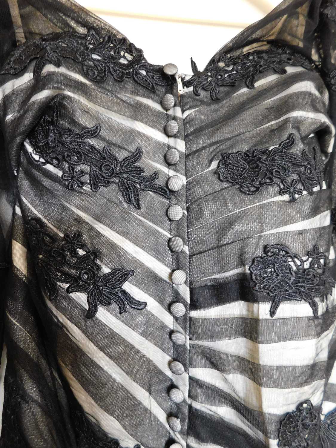 A black and cream gown by Dylan Queen, the cream dress with black net and lace overlay, moulded - Image 3 of 5