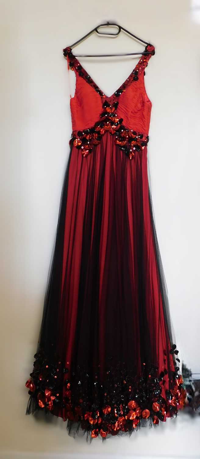 A red and black gown, the red silk with black net overlay, sleeveless with ruched bust and sequinned
