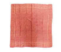 A Norwich silk shawl, in red paisley pattern, approx. 87 x 89cm edges slightly frayed but overall
